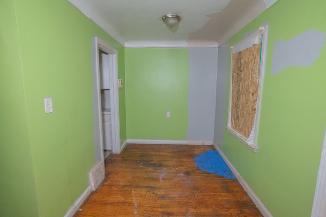 hallway with dark hardwood / wood-style floors