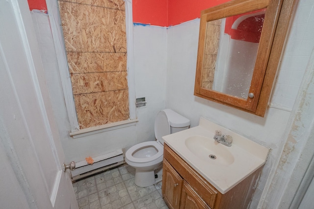 bathroom featuring vanity, toilet, and a baseboard heating unit