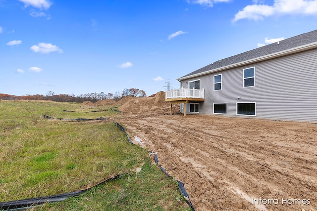 view of yard featuring a wooden deck