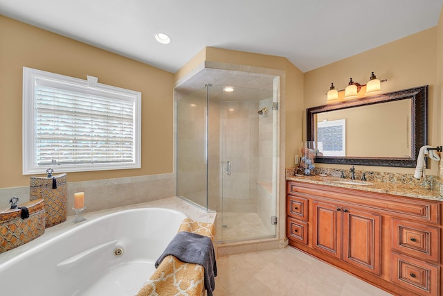 bathroom featuring vanity and plus walk in shower