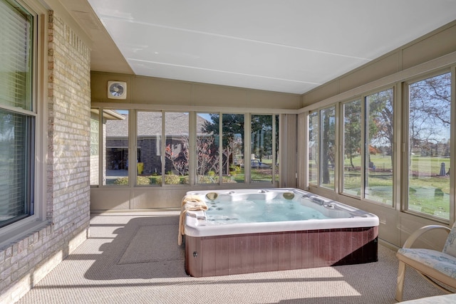 sunroom / solarium featuring a jacuzzi