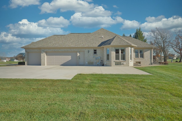 exterior space featuring a garage and a front lawn