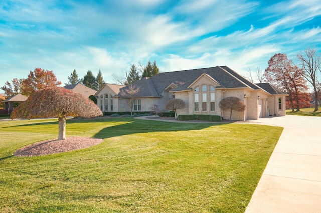 single story home featuring a garage and a front yard