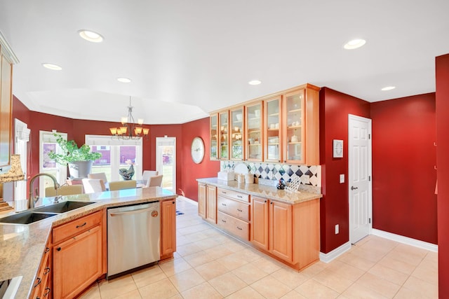 kitchen featuring pendant lighting, backsplash, an inviting chandelier, sink, and stainless steel dishwasher