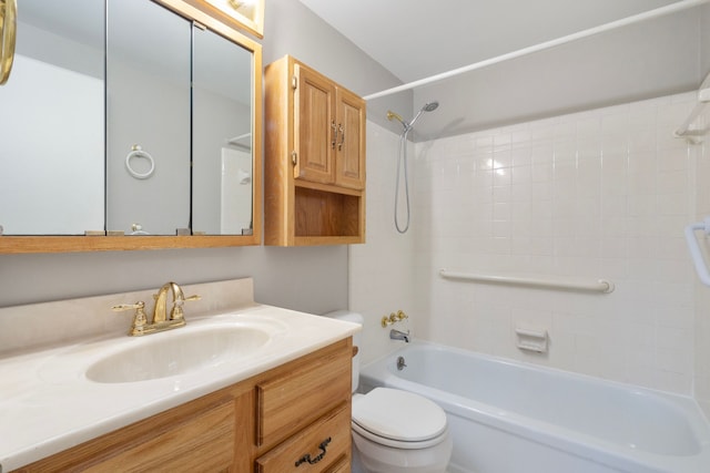 full bathroom featuring vanity, toilet, and tiled shower / bath