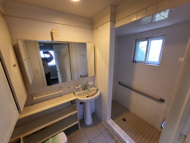 bathroom with backsplash, tile patterned floors, walk in shower, tile walls, and toilet