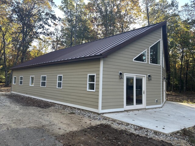1820 S Reid Rd, Custer, MI 49405 - back of house with a patio and metal roof