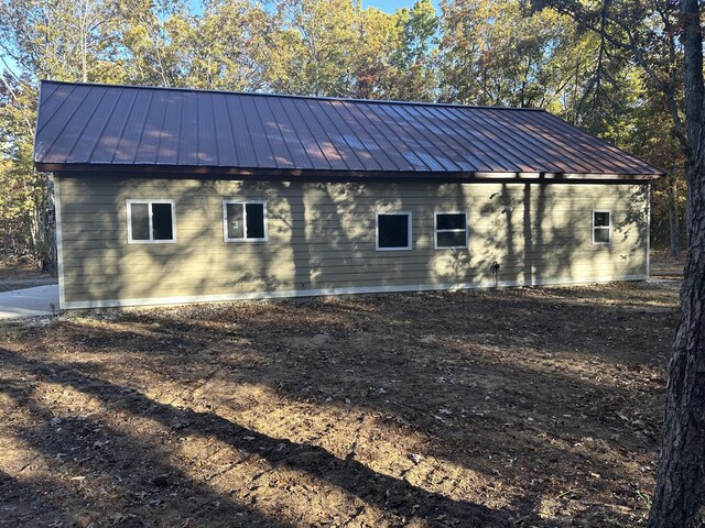1820 S Reid Rd, Custer, MI 49405 - view of home's exterior featuring a standing seam roof and metal roof