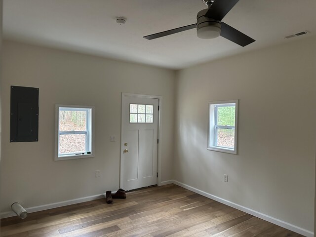 1820 S Reid Rd, Custer, MI 49405 - entryway with electric panel, ceiling fan, plenty of natural light, and light wood-type flooring