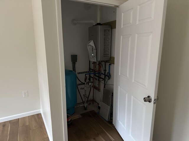 1820 S Reid Rd, Custer, MI 49405 - utility room featuring water heater