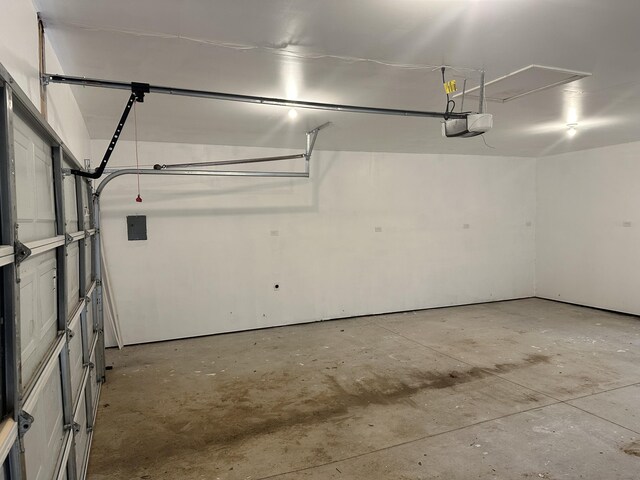 1820 S Reid Rd, Custer, MI 49405 - garage featuring a garage door opener