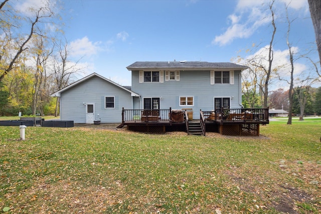 back of property with a lawn and a deck