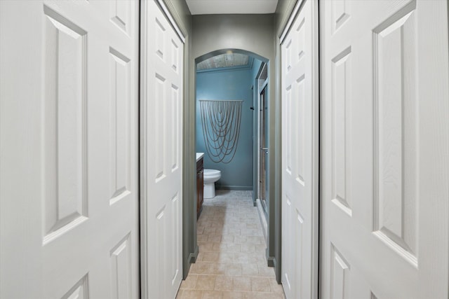 hall featuring light tile patterned floors