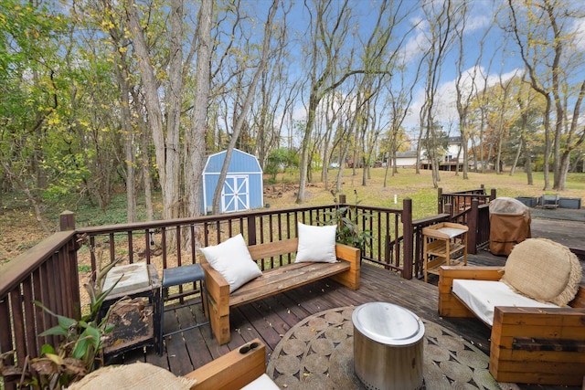 deck featuring a yard and a shed