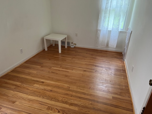 unfurnished room featuring light hardwood / wood-style flooring