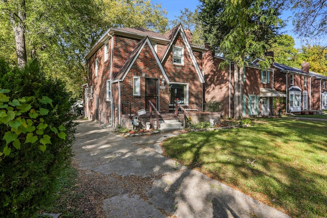13935 Faust Ave, Detroit, MI 48223 - view of front of property featuring brick siding, a front yard, and a chimney