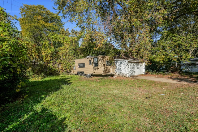 13935 Faust Ave, Detroit, MI 48223 - view of grassy yard with an outbuilding
