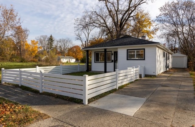 exterior space with a garage and an outdoor structure