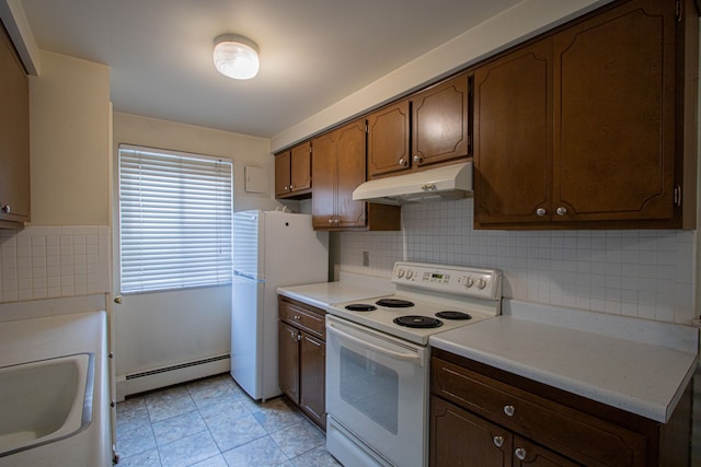 kitchen with decorative backsplash, white appliances, sink, and a baseboard radiator