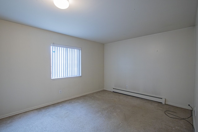 unfurnished room with light colored carpet and a baseboard heating unit