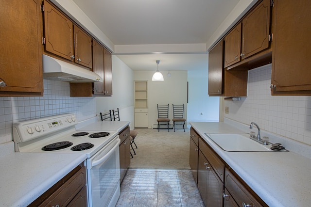 kitchen featuring decorative backsplash, sink, decorative light fixtures, white range with electric cooktop, and light tile patterned flooring