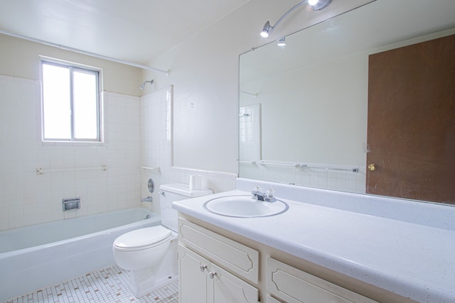 full bathroom with tile patterned floors, vanity, toilet, and tiled shower / bath combo