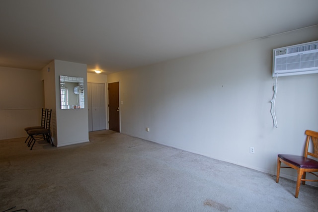 interior space featuring carpet flooring and a wall mounted AC