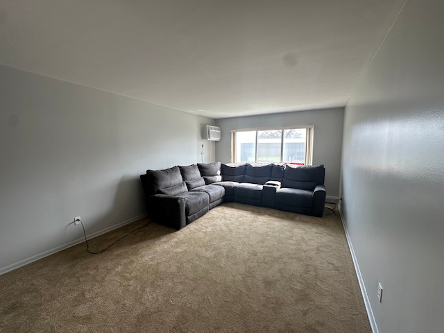 carpeted living area with an AC wall unit and baseboards