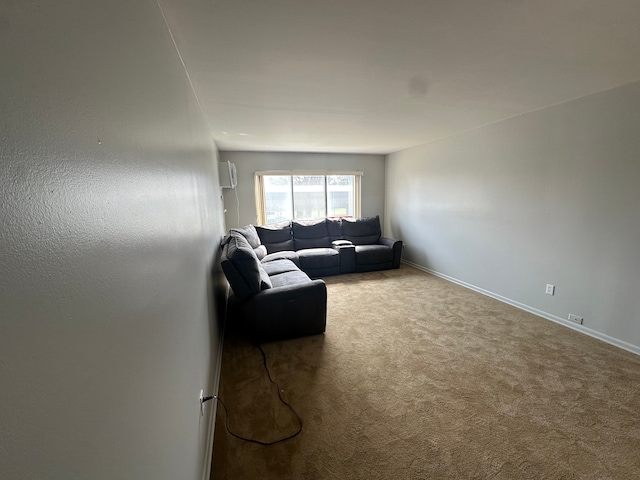 carpeted living room with baseboards and an AC wall unit