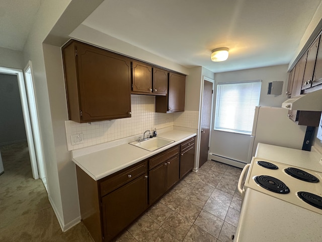 kitchen featuring dark brown cabinets, white electric range oven, a sink, baseboard heating, and light countertops