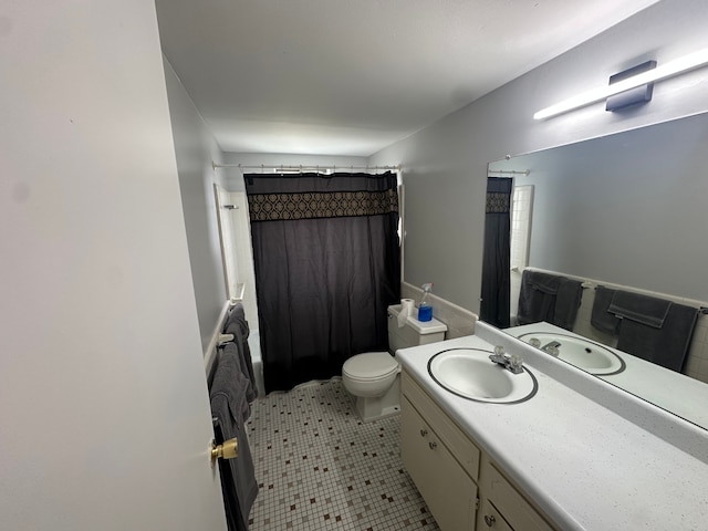 full bathroom with vanity, tile patterned flooring, a shower with curtain, and toilet