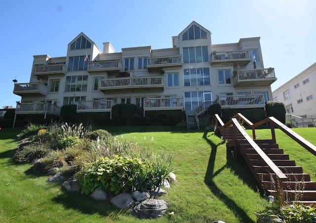 view of home's community with a lawn