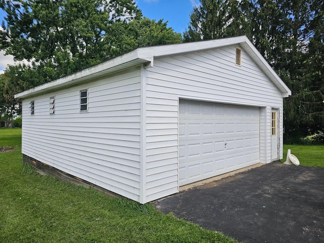 garage with a yard