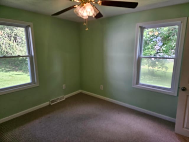 spare room with carpet flooring and ceiling fan