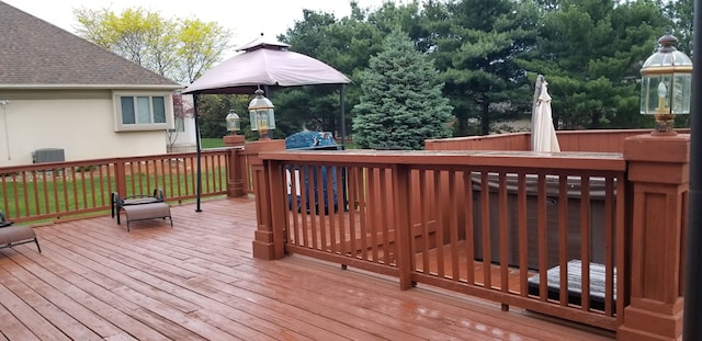 wooden terrace featuring central air condition unit