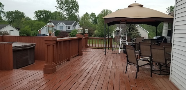 wooden deck featuring a gazebo