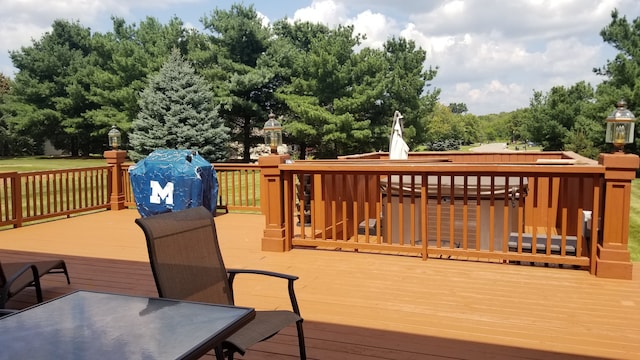 wooden terrace with a grill