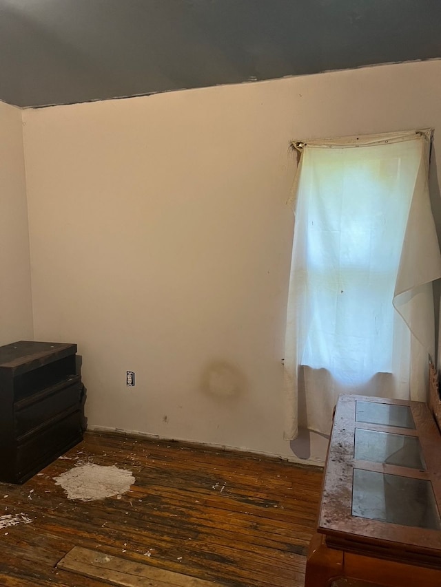 empty room with dark wood-type flooring