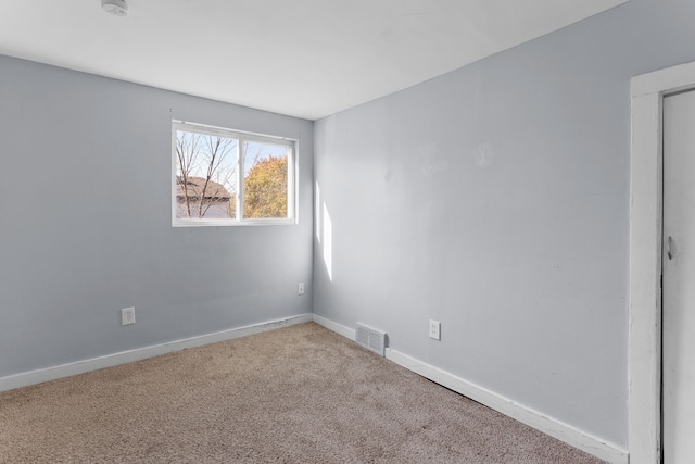 empty room featuring carpet floors