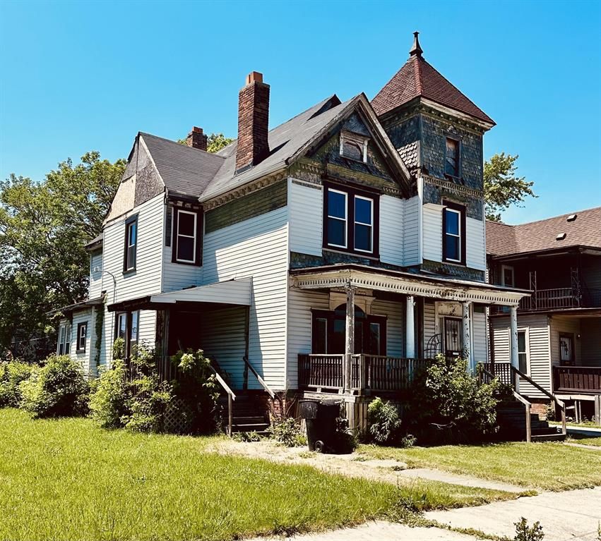 3715 14th St, Detroit, MI 48208 - victorian home with a porch, a front lawn, and a chimney