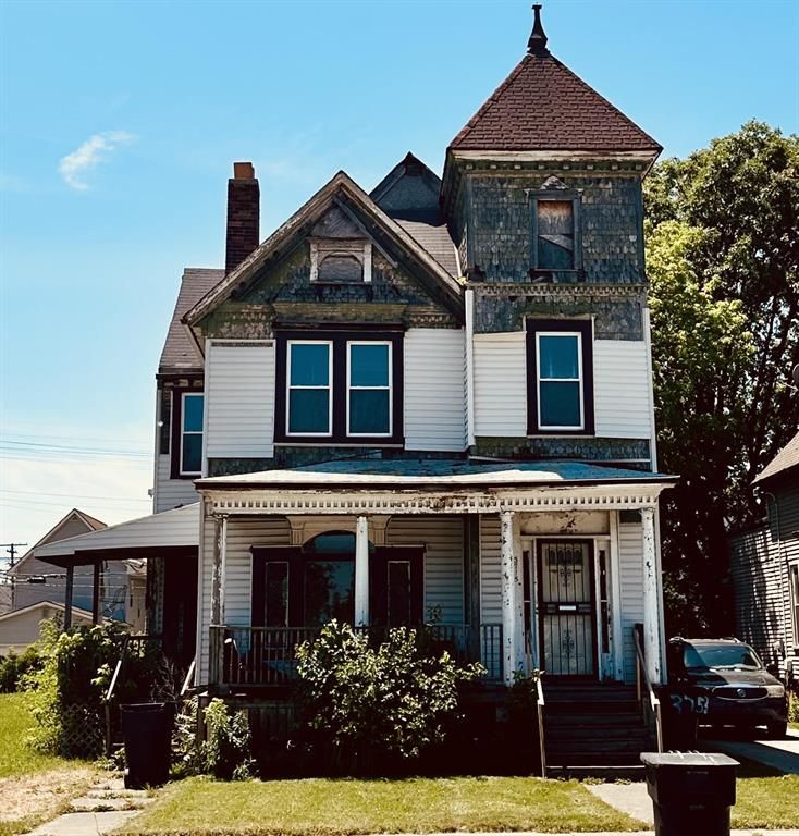 3715 14th St, Detroit, MI 48208 - view of front of property featuring a porch and a chimney