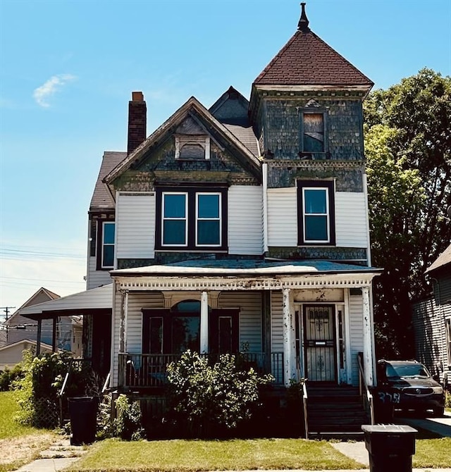 3715 14th St, Detroit, MI 48208 - view of front of property featuring a porch and a chimney