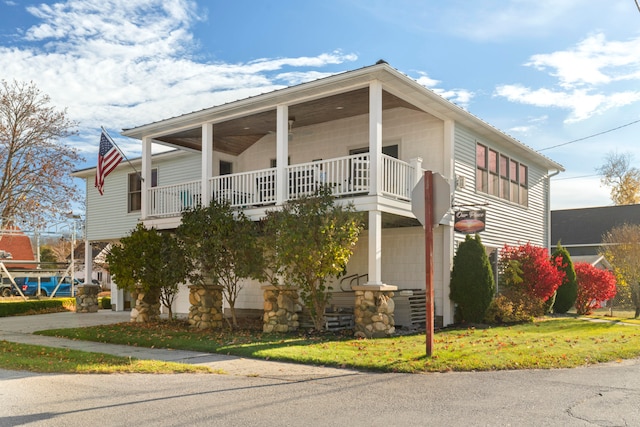 view of front of house featuring a balcony