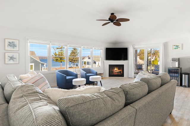 living room with light wood-type flooring, wine cooler, and ceiling fan