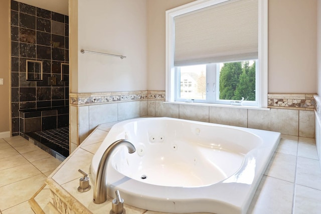 bathroom with tile patterned floors, tile walls, and plus walk in shower