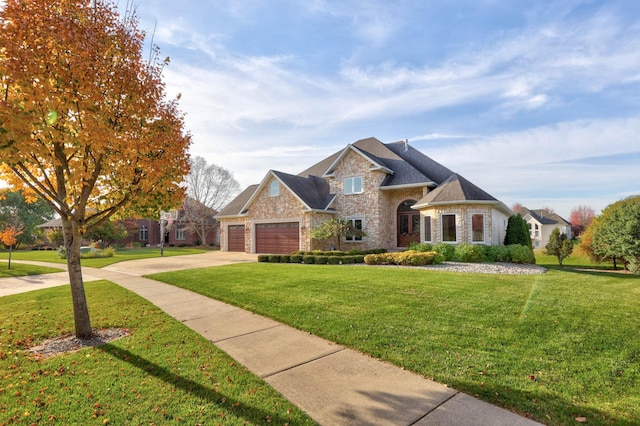 view of front of home featuring a garage and a front yard