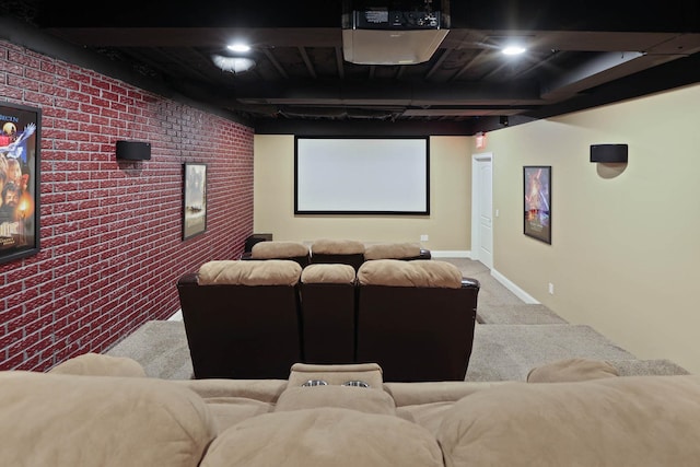 home theater with carpet flooring and brick wall