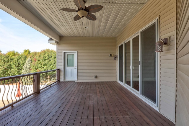 wooden terrace featuring ceiling fan