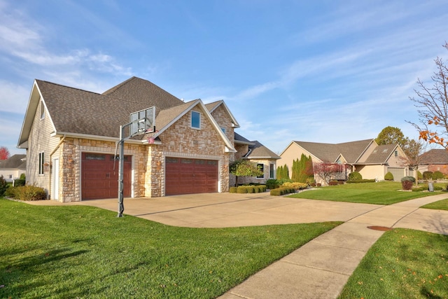 view of front of property with a front yard and a garage