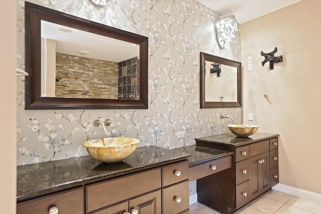 bathroom with tile patterned floors and vanity